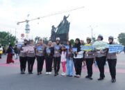 Gimik Tertib Lalu Lintas di CFD, Operasi Zebra Lancang Kuning Bawa Pesan Pilkada Damai